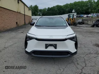2024 Toyota bZ4X XLE with VIN JTMABACA2RA087660, listed as a Copart auction lot 61295995 with 2,288 mi miles and Salvage title. Bid and sale history available at DreamBid. Image 5.