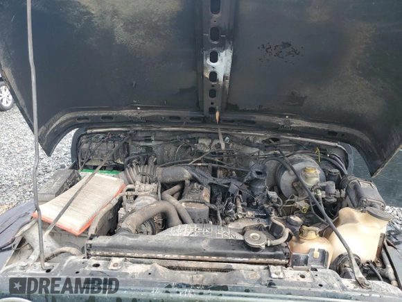 1998 Jeep Wrangler Sport with VIN 1J4FY19S5WP795781, listed as a Copart auction lot 59718065 with 208,416 mi miles and Salvage title. Bid and sale history available at DreamBid. Image 12.
