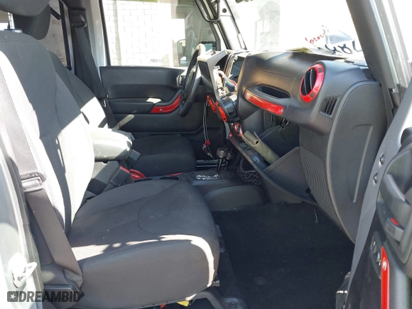 2015 Jeep Wrangler Unlimited Sport with VIN 1C4BJWDG7FL587014, listed as a IAAI auction lot 40641034 with 81,045 mi miles. Bid and sale history available at carsss.com. Image 5.