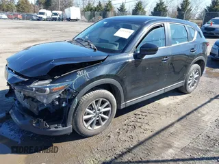 2023 Mazda CX-5 2.5 S with VIN JM3KFBAM9P0194078, listed as a IAAI auction lot 41579370 with 39,260 mi miles. Bid and sale history available at carsss.com. Image 2.