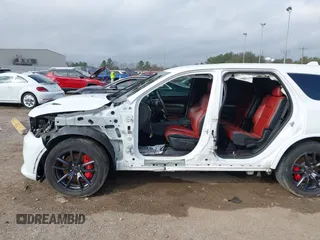 2018 Dodge Durango SRT with VIN 1C4SDJGJ4JC341550, listed as a IAAI auction lot 41525295 with 86,503 mi miles and . Bid and sale history available at DreamBid. Image 6.