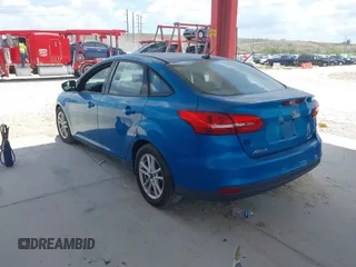 2015 Ford Focus SE with VIN 1FADP3F2XFL354354, listed as a IAAI auction lot 42183319 with 102,232 mi miles and . Bid and sale history available at carsss.com. Image 3.