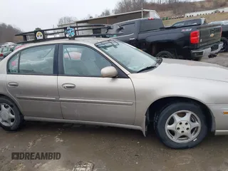 1999 Oldsmobile Cutlass GL z VIN 1G3NB52J8X6318863, wystawiony jako IAAI lot #41490091 z przebiegiem 106 821 mil mil oraz . Historia ofert i sprzedaży dostępna na DreamBid. Obrazek 13.