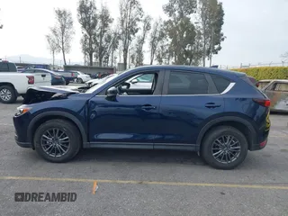 2019 Mazda CX-5 Touring with VIN JM3KFACM5K0697137, listed as a IAAI auction lot 41720253 with 50,416 mi miles. Bid and sale history available at carsss.com. Image 14.