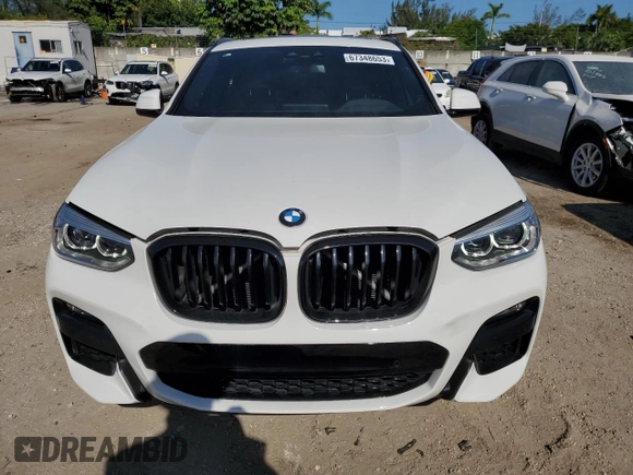 2021 BMW X4 xDrive30i with VIN 5UX2V1C0XM9E11002, listed as a Copart auction lot 67348653 with 27,805 mi miles. Bid and sale history available at carsss.com. Image 5.