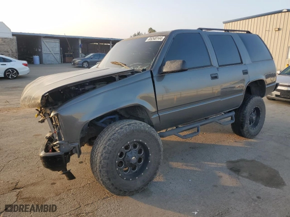 1999 Chevrolet Tahoe with VIN 1GNEC13R0XJ495650, listed as a Copart auction lot 85348144 with 0 mi miles and Salvage Title. Bid and sale history available at carsss.com. Image 1.