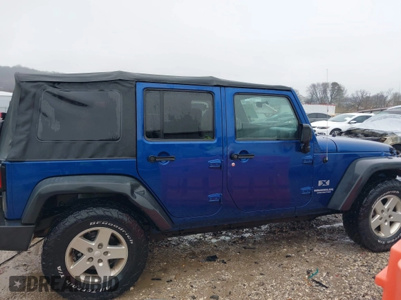 2009 Jeep Wrangler Unlimited X with VIN 1J4GA39189L787777, listed as a IAAI auction lot 41570579 with 193,163 mi miles. Bid and sale history available at carsss.com. Image 13.