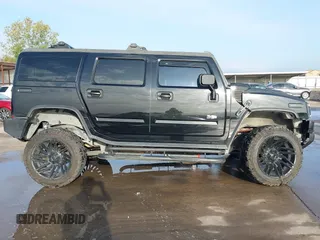 2003 Hummer H2 z VIN 5GRGN23UX3H112173, wystawiony jako IAAI lot #41093359 z przebiegiem Nie podano mil oraz . Historia ofert i sprzedaży dostępna na DreamBid. Obrazek 14.