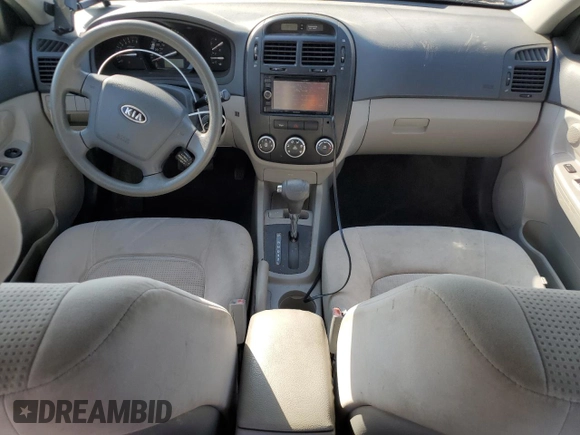 2009 Kia Spectra EX with VIN KNAFE221295654167, listed as a Copart auction lot 53377745 with 131,266 mi miles and Salvage Title. Bid and sale history available at DreamBid. Image 8.