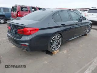 2019 BMW 5 Series M550i xDrive with VIN WBAJB9C51KB287797, listed as a IAAI auction lot 41549311 with 61,459 mi miles and . Bid and sale history available at DreamBid. Image 4.