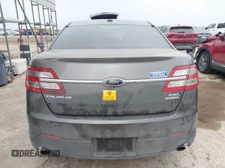 2015 Ford Taurus SEL z VIN 1FAHP2E85FG209085, wystawiony jako IAAI lot #41944532 z przebiegiem 143 850 mil mil oraz . Historia ofert i sprzedaży dostępna na DreamBid. Obrazek 16.