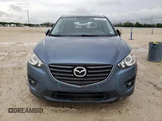 2016 Mazda CX-5 Touring with VIN JM3KE2CY4G0882671, listed as a Copart auction lot 51089555 with 50,951 mi miles and Salvage Title. Bid and sale history available at carsss.com. Image 5.