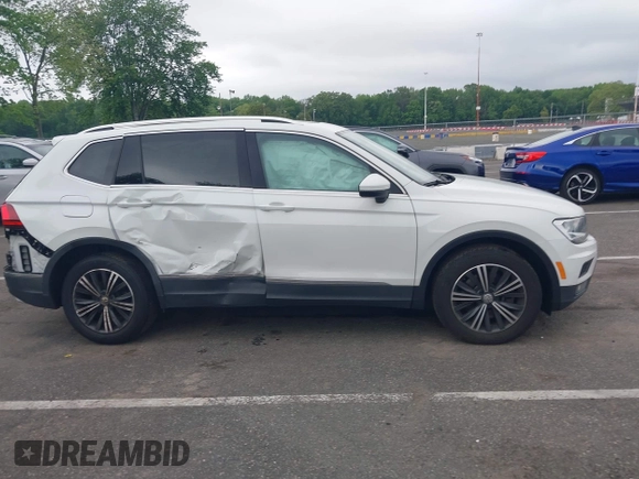 2018 Volkswagen Tiguan SEL with VIN 3VV2B7AX4JM012840, listed as a IAAI auction lot 42263511 with 105,510 mi miles and . Bid and sale history available at DreamBid. Image 13.