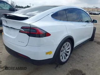 2020 Tesla Model X Long Range with VIN 5YJXCDE26LF238982, listed as a IAAI auction lot 42100220 with 44,804 mi miles. Bid and sale history available at carsss.com. Image 4.