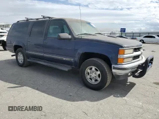 1997 Chevrolet Suburban z VIN 1GNFK16R9VJ309720, wystawiony jako Copart lot #48814475 z przebiegiem 198 109 mil mil oraz Czysty tytuł • Clean title. Historia ofert i sprzedaży dostępna na DreamBid. Obrazek 4.