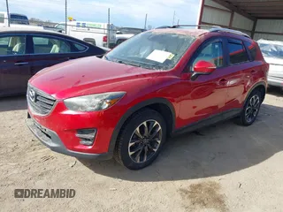 2016 Mazda CX-5 Grand Touring with VIN JM3KE4DY0G0709563, listed as a IAAI auction lot 41886956 with 156,769 mi miles. Bid and sale history available at carsss.com. Image 18.