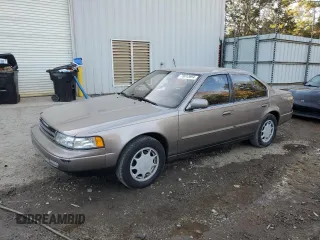 1990 Nissan Maxima z VIN JN1HJ01P3LT393901, wystawiony jako Copart lot #79912694 z przebiegiem 127 678 mil mil oraz Szkody całkowita. Historia ofert i sprzedaży dostępna na DreamBid. Obrazek 1.