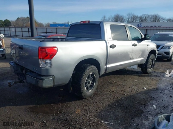 2010 Toyota Tundra 4WD Truck with VIN 5TFDW5F11AX142704, listed as a IAAI auction lot 41230112 with 201,697 mi miles. Bid and sale history available at carsss.com. Image 4.