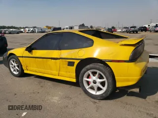 1986 Pontiac Fiero z VIN 1G2PG9796GP256622, wystawiony jako Copart lot #69203894 z przebiegiem 38 964 mil mil oraz Szkody całkowita. Historia ofert i sprzedaży dostępna na DreamBid. Obrazek 2.