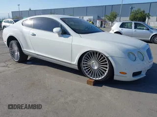 2005 Bentley Continental GT GT z VIN SCBCR63W65C030182, wystawiony jako IAAI lot #41528495 z przebiegiem 76 271 mil mil oraz . Historia ofert i sprzedaży dostępna na DreamBid. Obrazek 1.