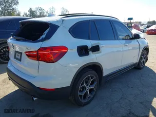 2016 BMW X1 xDrive28i with VIN WBXHT3C32G5E51855, listed as a IAAI auction lot 41634237 with 69,101 mi miles. Bid and sale history available at carsss.com. Image 4.