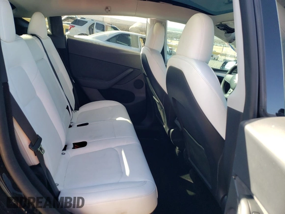 2023 Tesla Model Y Performance with VIN 7SAYGDEF3PF773031, listed as a Copart auction lot 47105765 with 25,604 mi miles and Salvage Title. Bid and sale history available at DreamBid. Image 10.