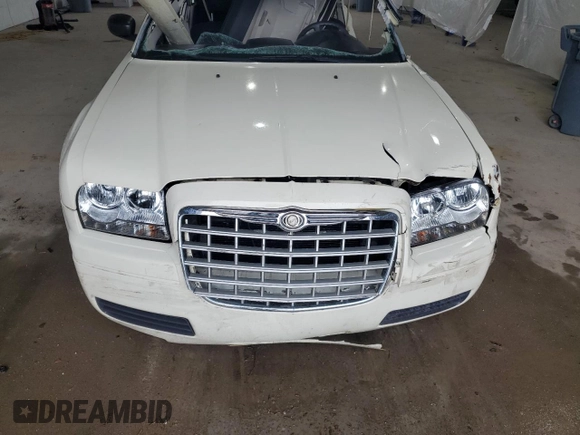 2005 Chrysler 300 300 z VIN 2C3AA43R35H584162, wystawiony jako Copart lot #57164895 z przebiegiem Nie podano mil oraz Szkoda całkowita • Salvage title. Historia ofert i sprzedaży dostępna na DreamBid. Obrazek 11.