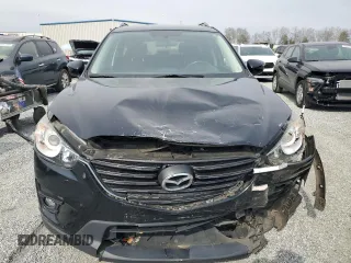 2016 Mazda CX-5 Touring with VIN JM3KE2CY1G0654434, listed as a Copart auction lot 48974115 with 83,977 mi miles and Salvage Title. Bid and sale history available at carsss.com. Image 5.