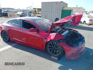 2022 Tesla Model S Plaid with VIN 5YJSA1E61NF460253, listed as a IAAI auction lot 40328727 with Not provided miles and . Bid and sale history available at DreamBid. Image 1.