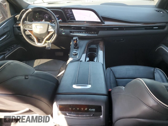 2023 Cadillac Escalade RWD Premium Luxury z VIN 1GYS3BKL4PR395559, wystawiony jako Copart lot #48347285 z przebiegiem 3 818 mil mil oraz Szkoda całkowita • Salvage title. Historia ofert i sprzedaży dostępna na DreamBid. Obrazek 8.