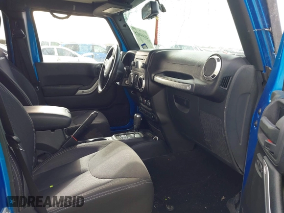 2015 Jeep Wrangler Unlimited Rubicon with VIN 1C4BJWFG5FL558348, listed as a IAAI auction lot 41460025 with 106,012 mi miles. Bid and sale history available at carsss.com. Image 5.