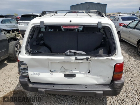 1998 Jeep Grand Cherokee Laredo with VIN 1J4GZ58S4WC244954, listed as a Copart auction lot 55731465 with 205,766 mi miles and Salvage title. Bid and sale history available at DreamBid. Image 6.