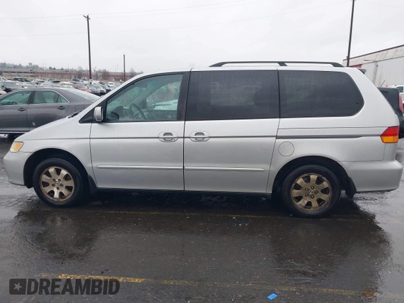 2004 Honda Odyssey EX-L with VIN 5FNRL18934B016420, listed as a IAAI auction lot 41473237 with 188,659 mi miles and . Bid and sale history available at DreamBid. Image 14.