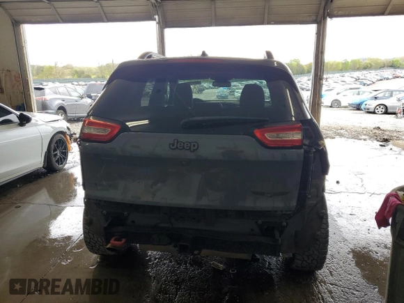 2014 Jeep Cherokee Trailhawk z VIN 1C4PJMBB0EW309277, wystawiony jako Copart lot #52370565 z przebiegiem 148 924 mil mil oraz Czysty tytuł • Clean title. Historia ofert i sprzedaży dostępna na DreamBid. Obrazek 6.