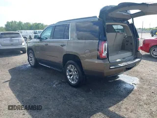 2016 GMC Yukon SLT with VIN 1GKS1BKC9GR328861, listed as a IAAI auction lot 42010839 with 200,711 mi miles. Bid and sale history available at carsss.com. Image 3.