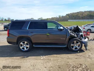 2015 Chevrolet Tahoe LTZ with VIN 1GNSKCKC3FR640615, listed as a IAAI auction lot 40843080 with 142,445 mi miles. Bid and sale history available at carsss.com. Image 13.
