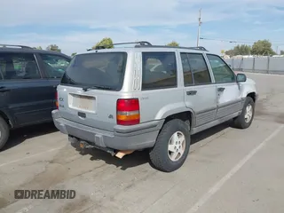 1994 Jeep Grand Cherokee Laredo with VIN 1J4GZ58YXRC325868, listed as a IAAI auction lot 42664900 with 220,149 mi miles and . Bid and sale history available at DreamBid. Image 4.