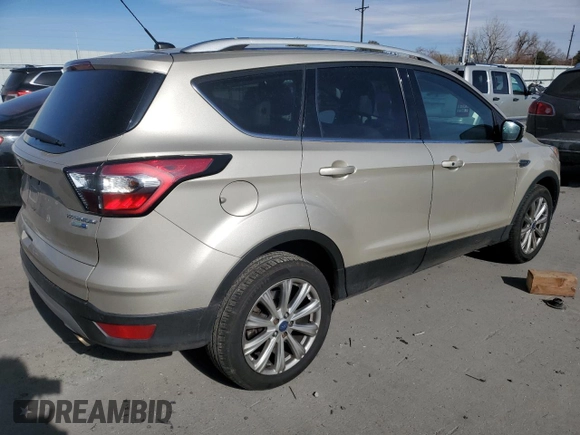 2017 Ford Escape Titanium with VIN 1FMCU9JD8HUE83650, listed as a Copart auction lot 48498245 with 103,920 mi miles and Salvage Title. Bid and sale history available at carsss.com. Image 3.