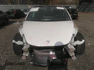 2020 Tesla Model 3 Standard Range Plus with VIN 5YJ3E1EA4LF792830, listed as a IAAI auction lot 41852919 with 76,461 mi miles. Bid and sale history available at carsss.com. Image 12.