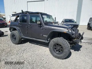 2014 Jeep Wrangler Unlimited Rubicon with VIN 1C4BJWFG0EL274480, listed as a Copart auction lot 48201845 with 130,503 mi miles and Salvage Title. Bid and sale history available at carsss.com. Image 4.