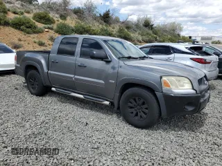 2006 Mitsubishi Raider Duro Cross z VIN 1Z7HC38N86S542959, wystawiony jako Copart lot #57301385 z przebiegiem 149 167 mil mil oraz Tytuł czysty. Historia ofert i sprzedaży dostępna na DreamBid. Obrazek 4.