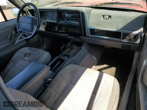 1995 Jeep Cherokee Sport with VIN 1J4FJ67S6SL549912, listed as a Copart auction lot 61104474 with 296,507 mi miles and Clean Title. Bid and sale history available at carsss.com. Image 8.