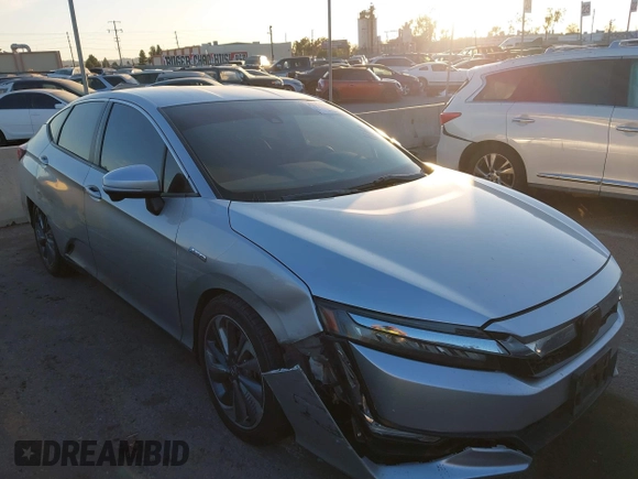2018 Honda Clarity with VIN JHMZC5F15JC018312, listed as a IAAI auction lot 41354648 with 97,035 mi miles and . Bid and sale history available at DreamBid. Image 1.