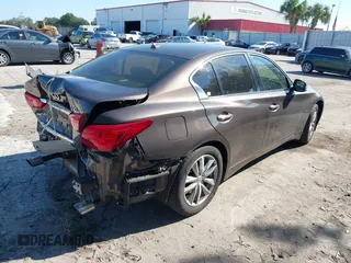 2015 Infiniti Q50 Premium z VIN JN1BV7AR3FM396882, wystawiony jako IAAI lot #37523335 z przebiegiem 89 761 mil mil oraz . Historia ofert i sprzedaży dostępna na DreamBid. Obrazek 4.