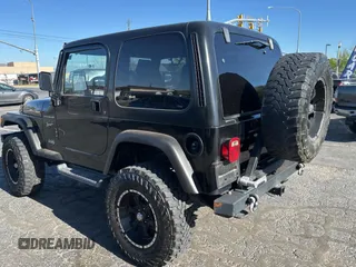 2002 Jeep Wrangler Sport with VIN 1J4FA49S32P765579, listed as a Copart auction lot 55244845 with 127,791 mi miles and Clean Title. Bid and sale history available at carsss.com. Image 3.