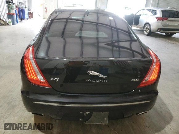 2014 Jaguar XJ with VIN SAJWA1CZ0E8V61168, listed as a Copart auction lot 54383215 with 137,724 mi miles and Salvage Title. Bid and sale history available at DreamBid. Image 6.