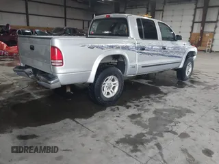 2004 Dodge Dakota SLT with VIN 1D7HG48N64S523528, listed as a IAAI auction lot 41199575 with 261,239 mi miles. Bid and sale history available at carsss.com. Image 4.