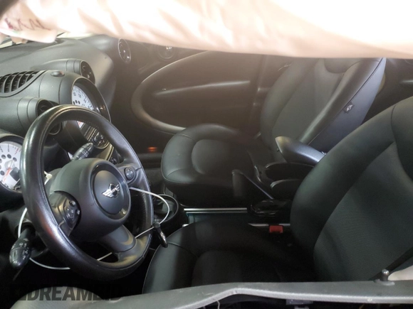 2014 MINI Countryman with VIN WMWZB3C58EWR37237, listed as a Copart auction lot 55596935 with 127,458 mi miles and Salvage Title. Bid and sale history available at DreamBid. Image 7.