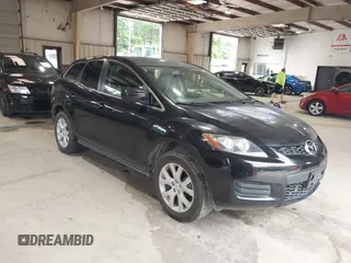 2009 Mazda CX-7 Grand Touring z VIN JM3ER293290221706, wystawiony jako IAAI lot #42374433 z przebiegiem 147 883 mil mil oraz . Historia ofert i sprzedaży dostępna na DreamBid. Obrazek 1.