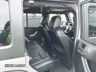 2013 Jeep Wrangler Unlimited Rubicon z VIN 1C4BJWFG7DL667083, wystawiony jako IAAI lot #42016912 z przebiegiem 148 933 mil mil oraz . Historia ofert i sprzedaży dostępna na DreamBid. Obrazek 8.